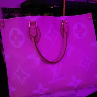 Pink Louis V  in purple light