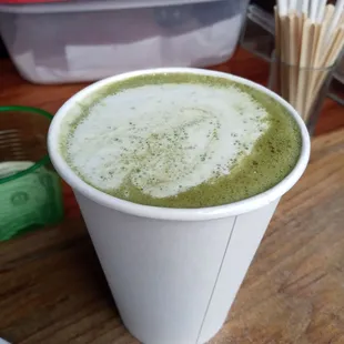 a cup of matcha with matcha sticks