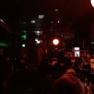 It's a bit dark, but the bar is to the right, the DJ is located slightly above the bar and the dance floor is straight ahead.