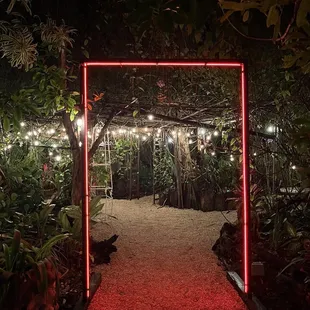 a pathway with a red light in the middle