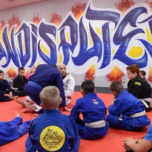 Brown Belt instructor, Coach Matt Blank, teaching another stellar youth jiu jitsu class!
