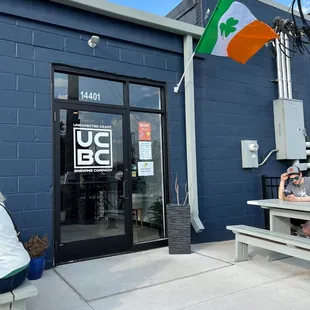 a woman sitting on a bench outside