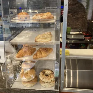 a display case filled with pastries