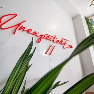 a neon sign on the wall