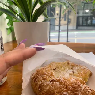 a pastry and a cup of coffee