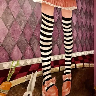 a woman's legs in striped stockings