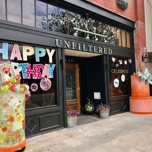 a birthday cake outside of a store