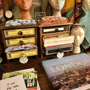 a table with books and a statue