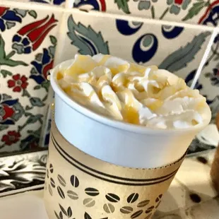 Caramel macchiato with whip cream and caramel drizzle