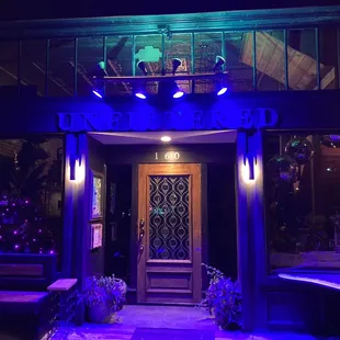 The facade of this store after sunset makes me wonder why it isn't open at night for coffee!!