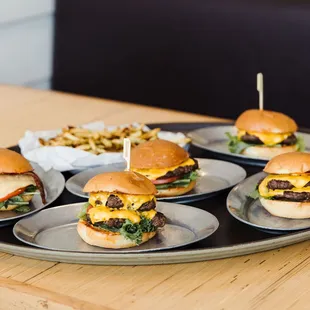 a tray of hamburgers and fries