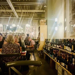 Indoor sitting. Lots of wines around. IG@loveplaypeace