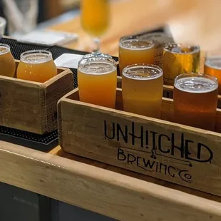 a variety of beers in wooden crates