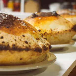 a row of baked breads