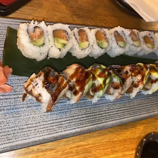 a plate of sushi and a glass of wine