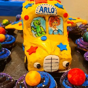 Magic School Bus with hand painted characters in the windows. All covered in chocolate, no fondant).