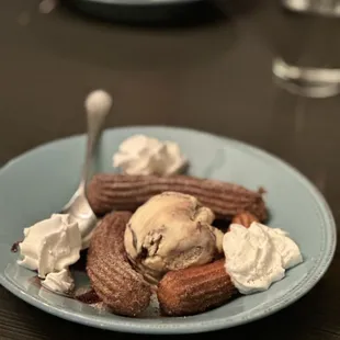 a plate of ice cream and cookies