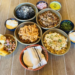 bowls of mexican food on a wooden table