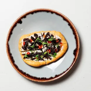 a small pizza on a plate