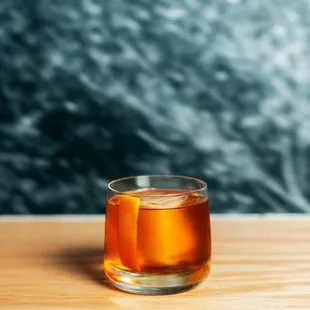 a glass of tea on a wooden table