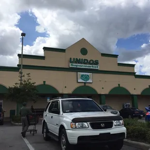 a white truck parked in front of a building