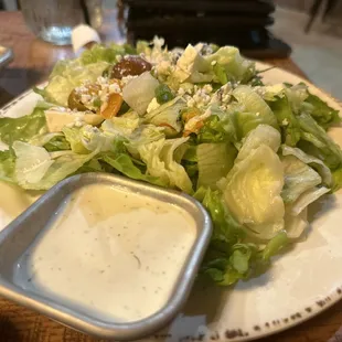 a plate of salad with dressing