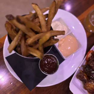 Hand-Cut Fries with garlic truffle aioli, espresso chipotle bbq, and sambal chili aioli