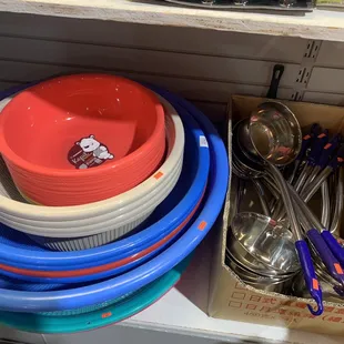 a stack of bowls and spoons