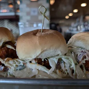 Fried chicken sliders with the chicken tossed in triple pepper sauce.