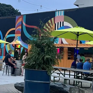 More outside seating with mural backdrop