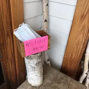 a pink sign on a chair