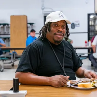 Program man enjoying lunch