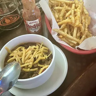Bowl of chili and fries with cheese