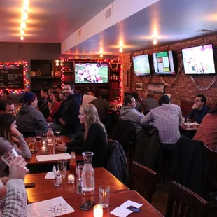 a large group of people sitting at a restaurant