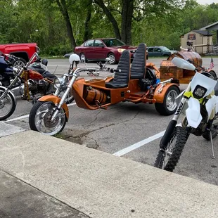 motorcycles parked in a parking lot