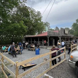 a group of people sitting at picnic tables