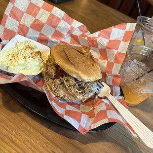 a pulled pork sandwich and coleslaw