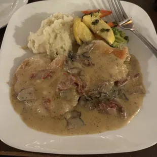 Chicken with Champagne sauce, mushrooms and some provolone. Sides veggies, and mash