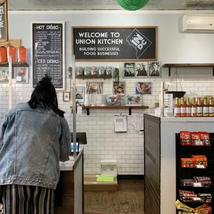 a woman standing at the counter