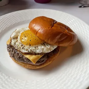 a burger with an egg on a bun