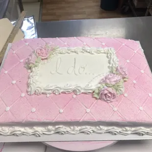 a pink and white cake