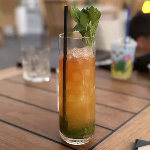 a glass of iced tea on a table