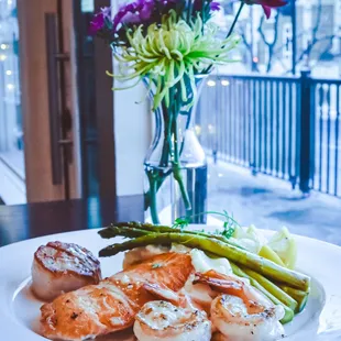 Seafood Lover, seared salmon, scallop, and shrimp, seafood risotto, asparagus, lemon butter drizzle