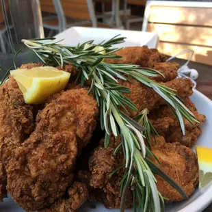 Chicken. Def for 4 as suggested. Delicious and juicy. Ask for their house Aioli as a dip!