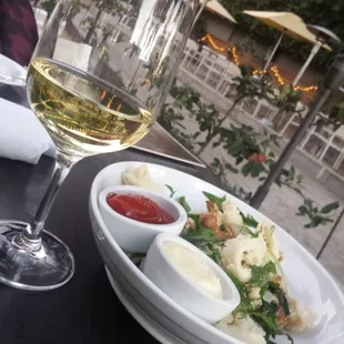 Fried calamari and some white wine. The tart ketchup sauce was soo yummy.