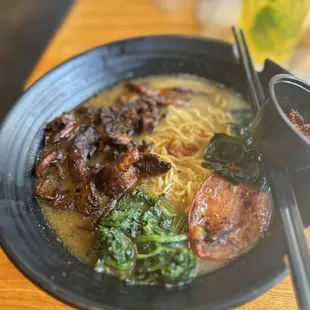a bowl of ramen and chopsticks