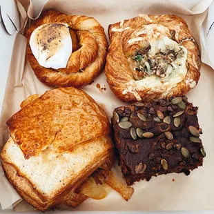 a variety of pastries in a box