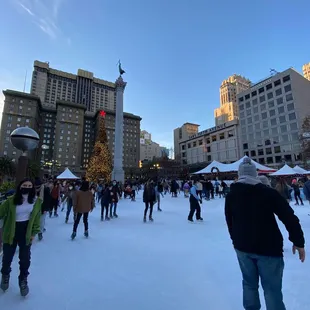 Skating rink in the city by the tree at union square