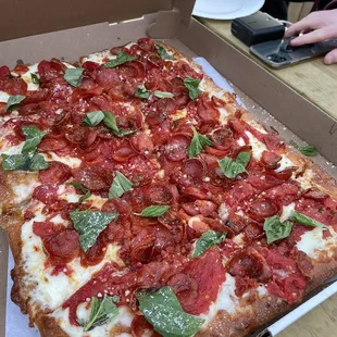 pepperoni, basil, and mozzarella pizza