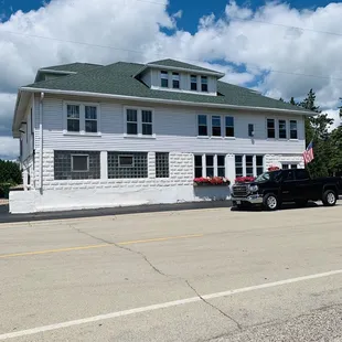 a truck parked in front of the building